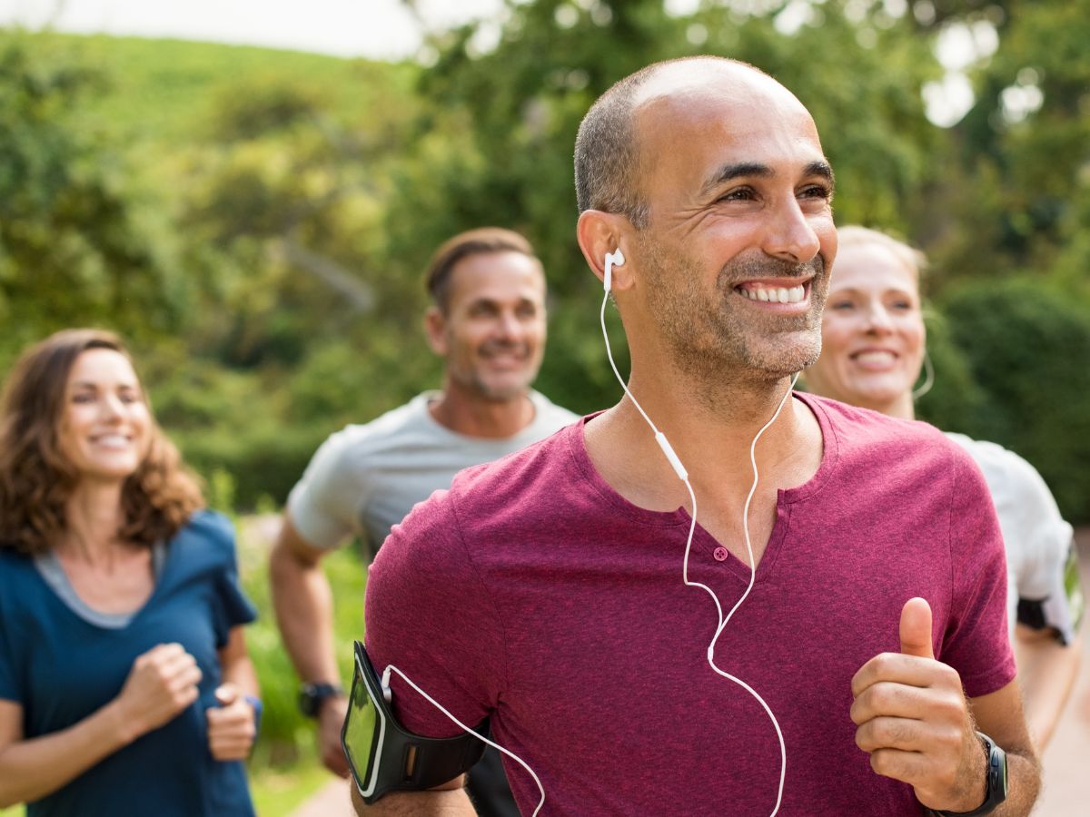 4 people jogging outdoors