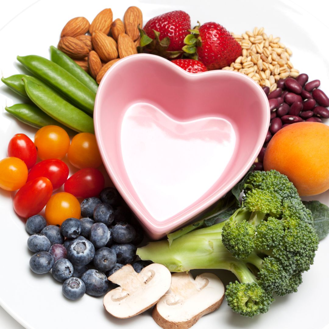 Fruits and vegetables and a heart shaped bowl